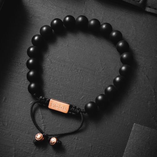 Matte Black Bracelet - Our Matte Black Bead Bracelet Features Natural Stones, Waxed Cord and Brushed Rose Gold Steel Hardware. A Beautiful Addition to any Collection.